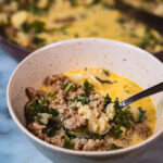 sausage and kale soup in a bowl