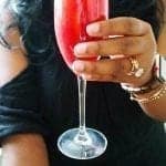 holding a blood orange mimosa