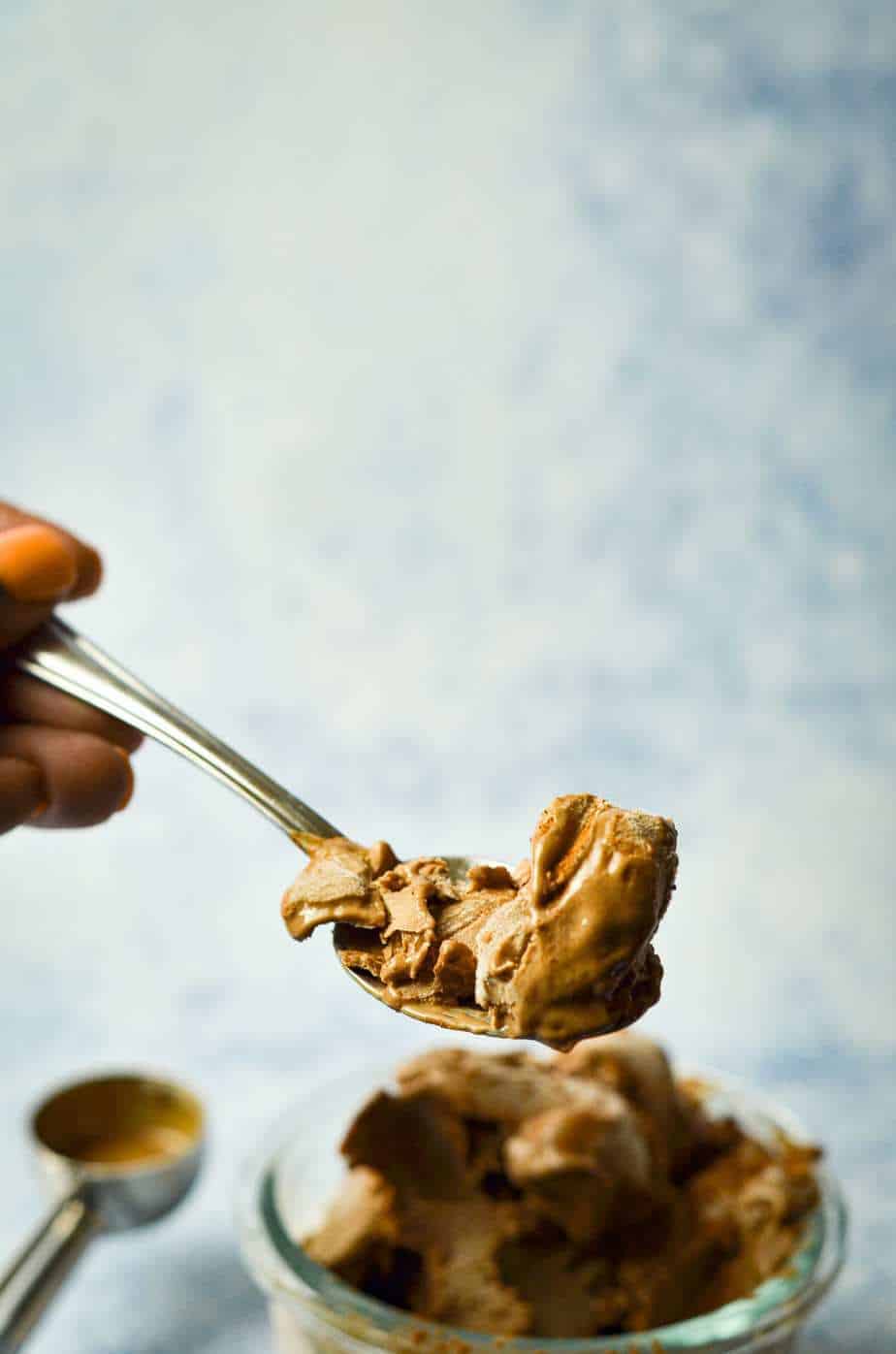 Low carb keto ice cream swirled on a spoon.