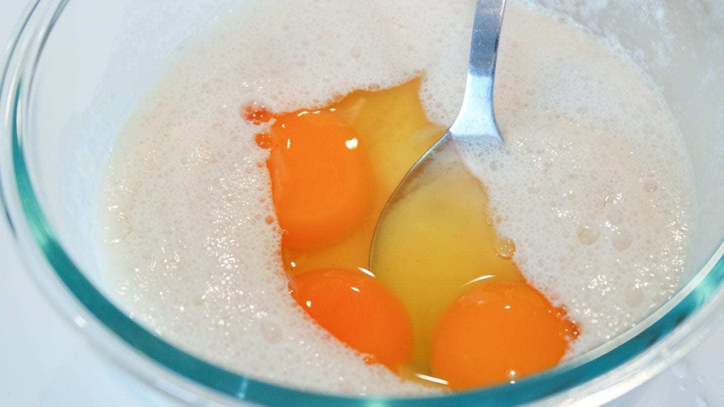 Yeast and eggs being mixed together. 