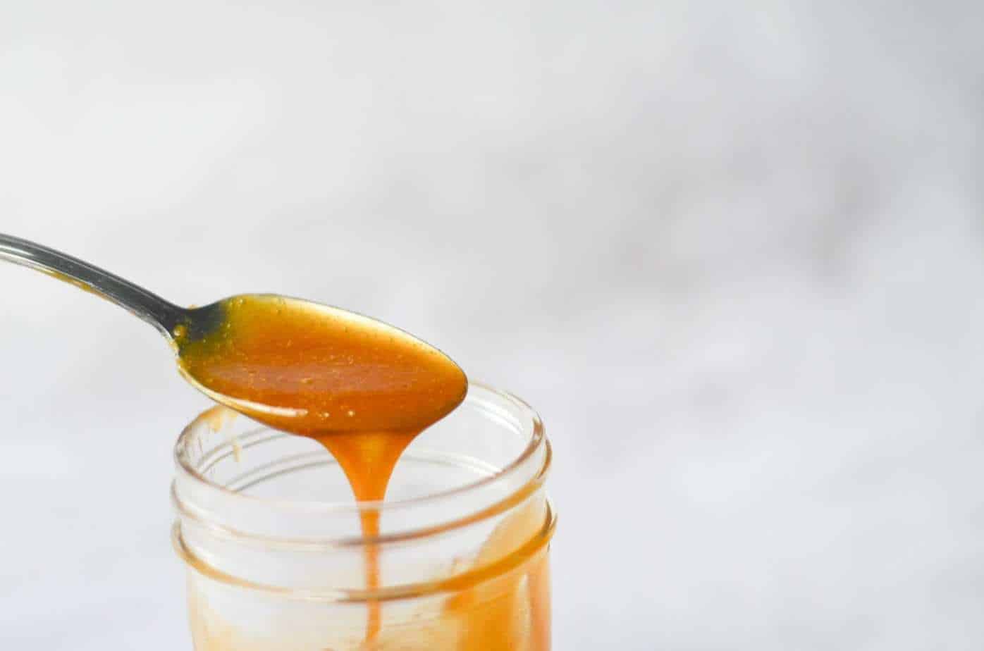 Sugar Free Caramel Sauce drizzled into mason jar