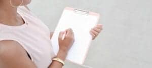 woman holding a clipboard