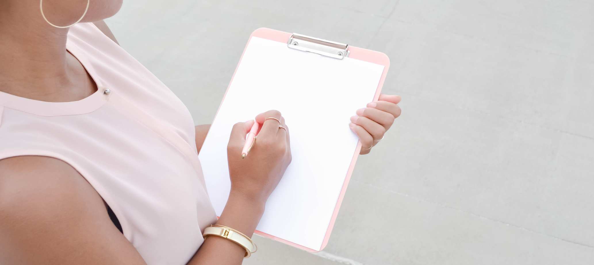woman holding a clipboard