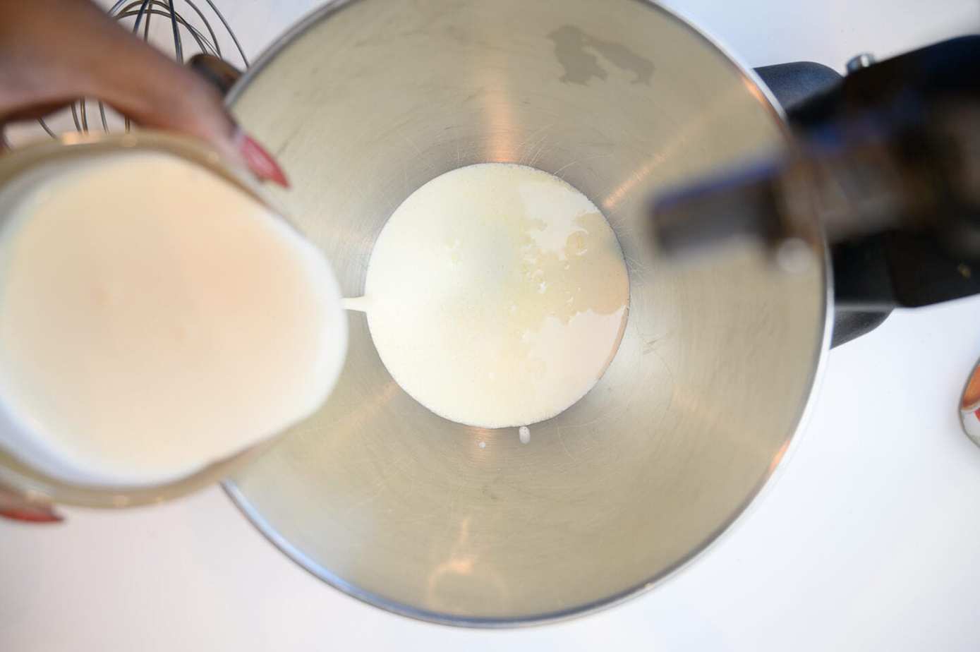 Heavy cream in a stand mixer bowl