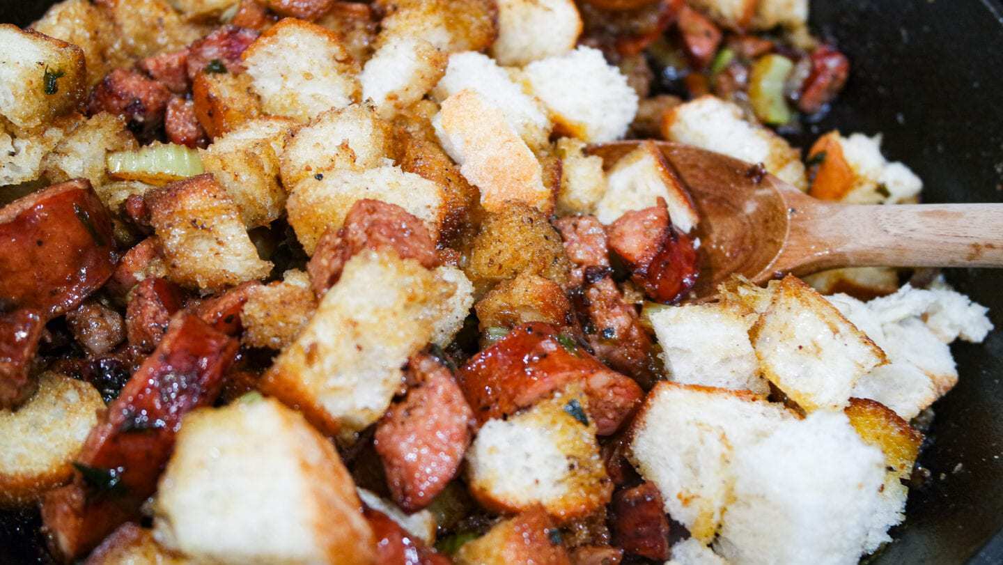 Sausage with bread in a cast iron pan