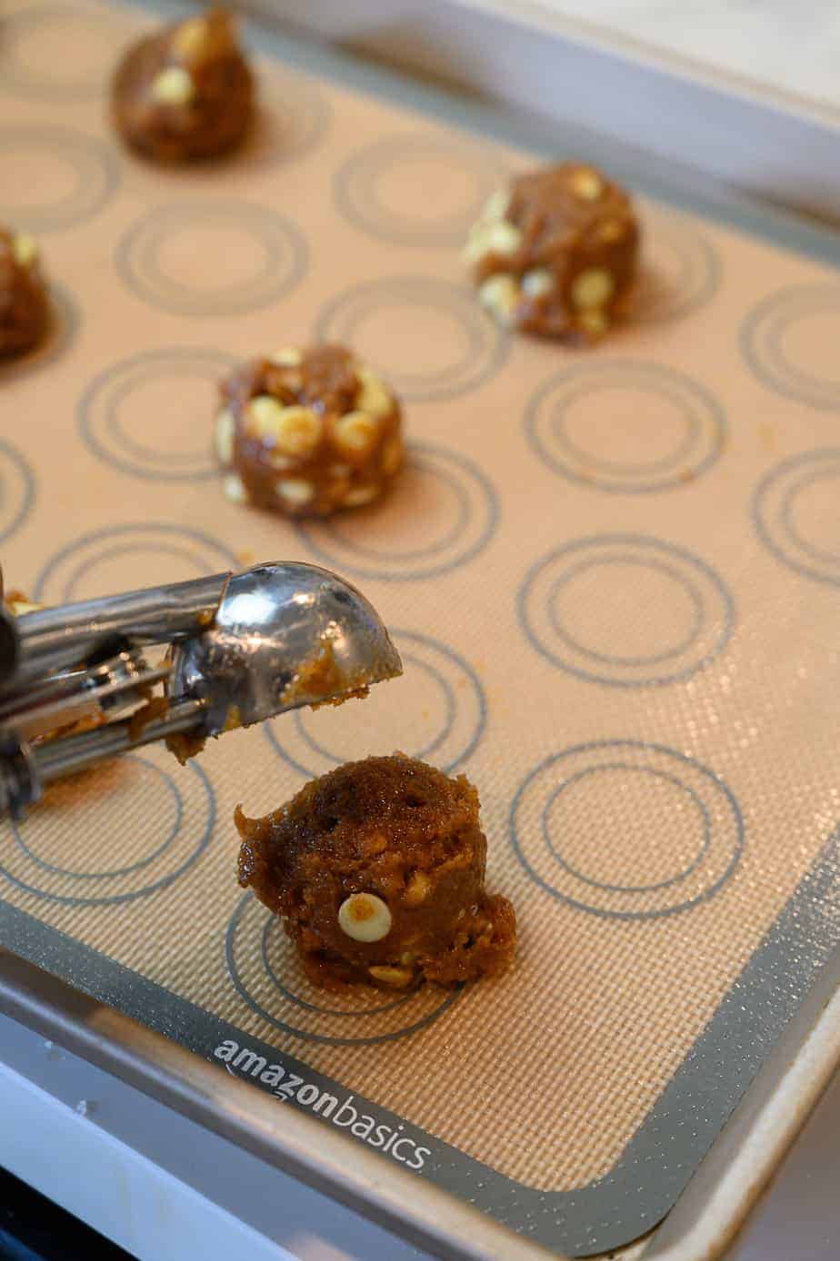 white chocolate macadamia nut cookie balls with cookie scoop