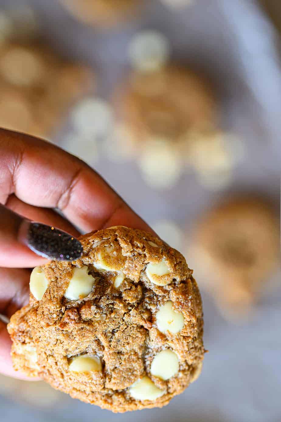 white chocolate macadamia nut cookies held in hand