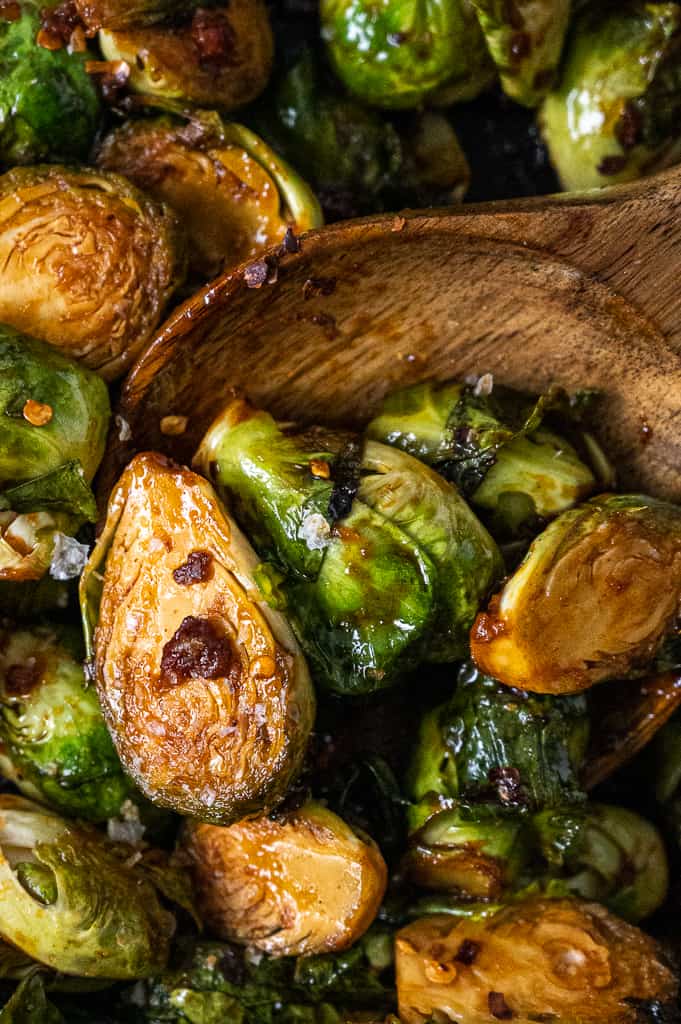 Close up photo of Gochujang brussels sprouts with pancetta in a pot