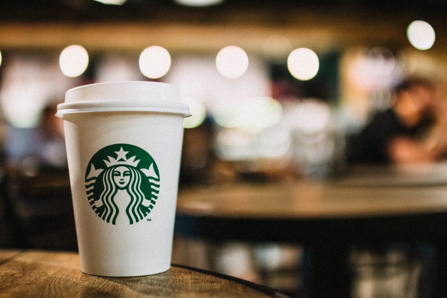 starbucks drink in front of baristas