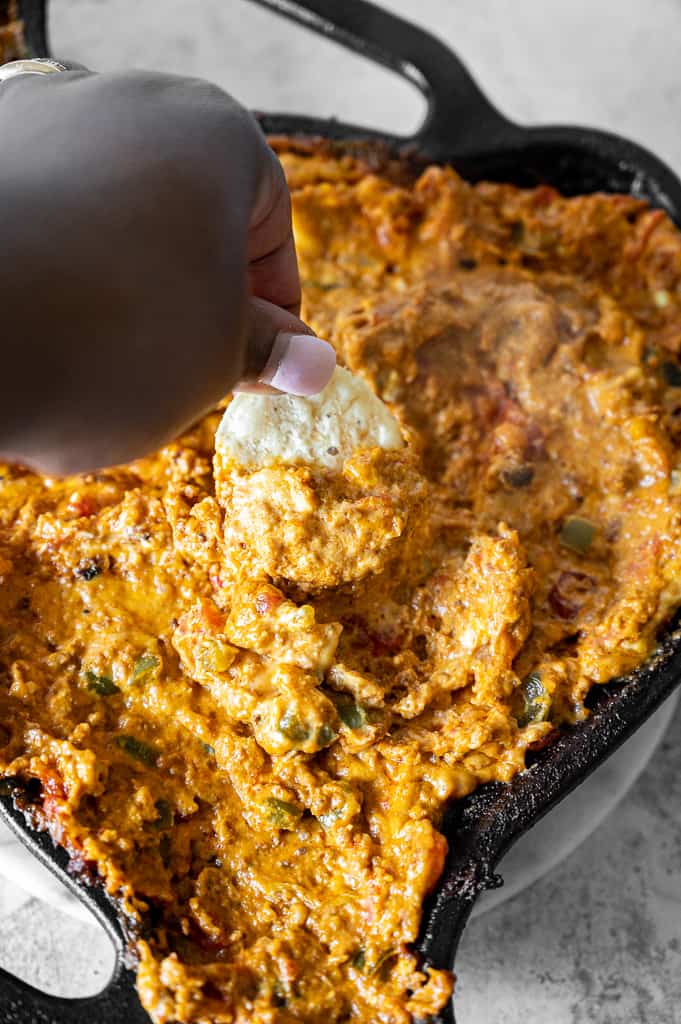 Chip dipped into smoked queso