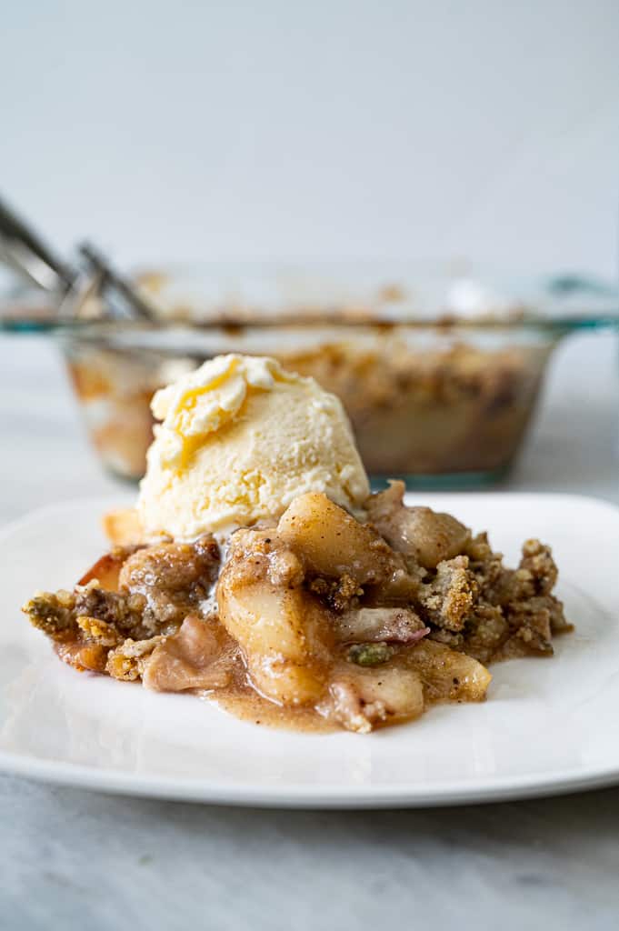 Peach crumble with ice cream on top