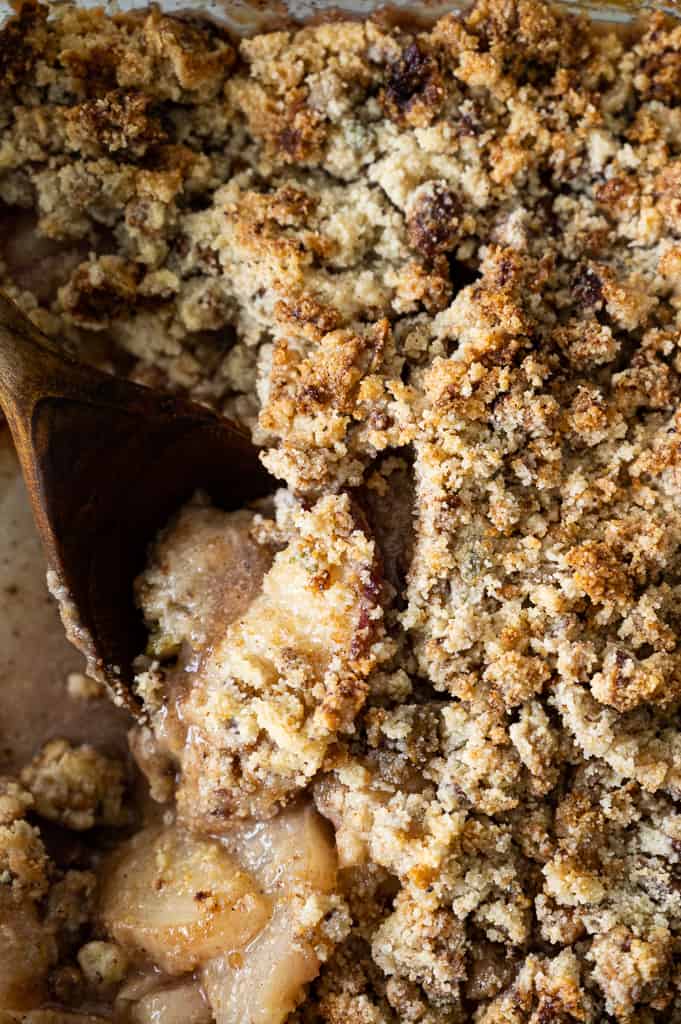 Peach crumble topping with spoon