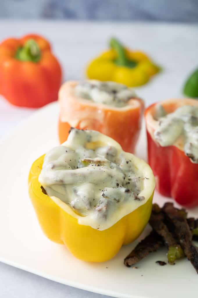 Yellow bell pepper with provolone cheese on top. 