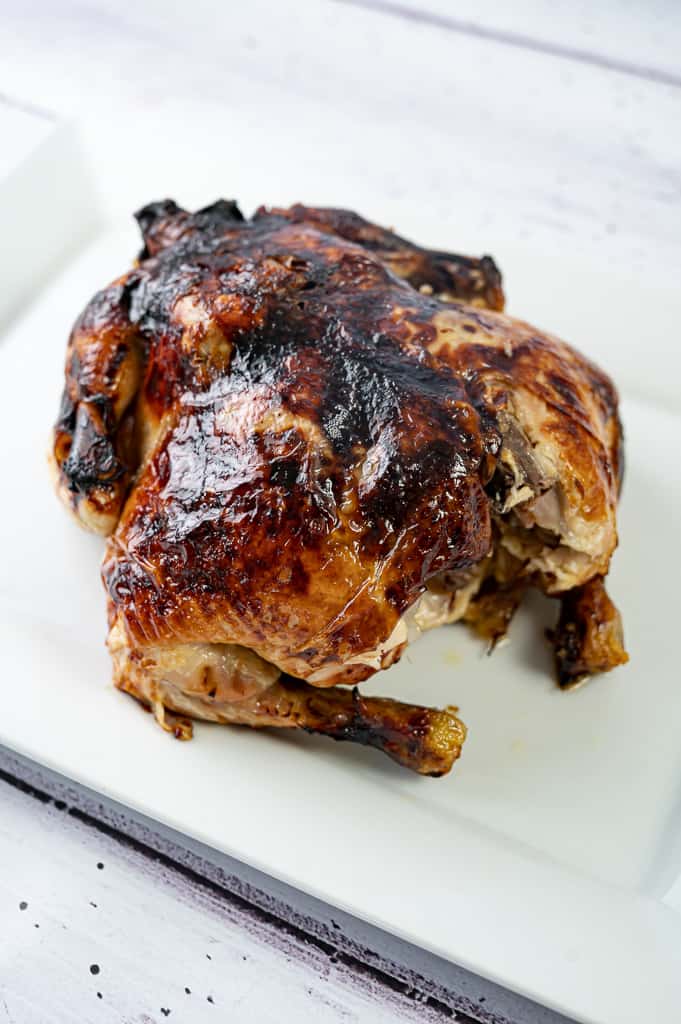 Pressure cooker chicken on a plate with crispy skin. 