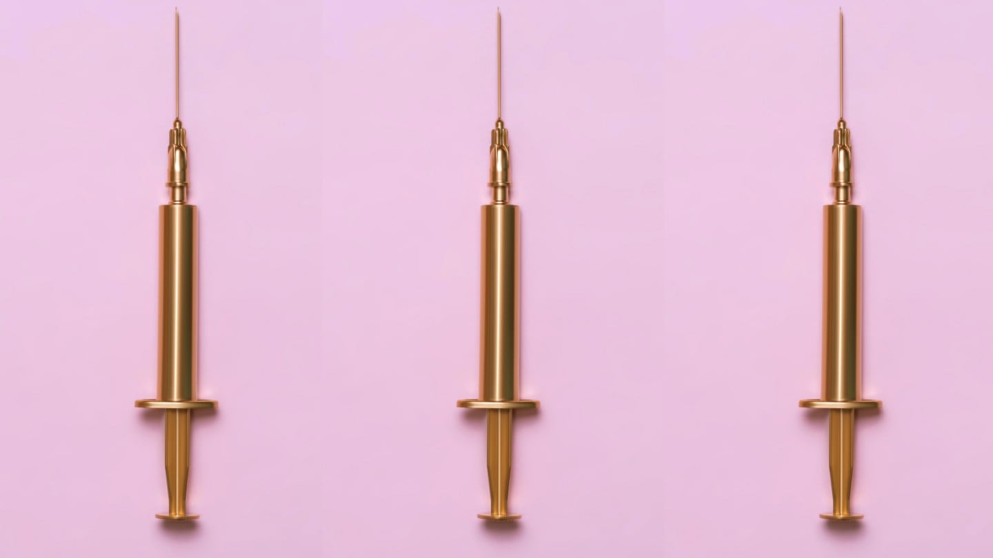 gold syringes on standing up