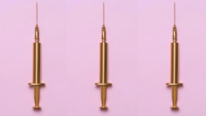 gold syringes on standing up