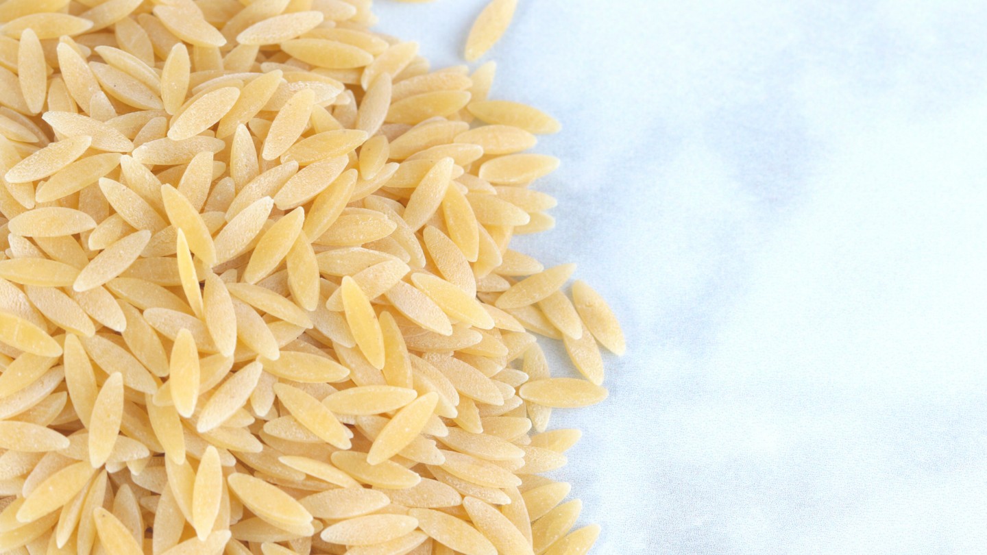uncooked orzo pasta on a table