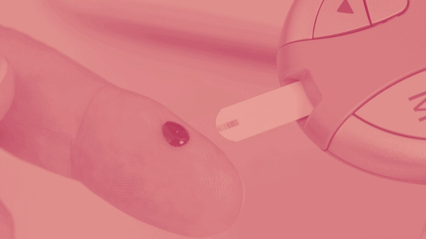 blood on a finger for glucose reading