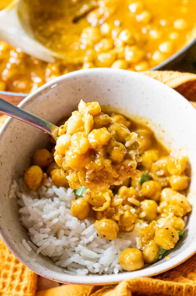 Vegan chickpea curry on a spoon