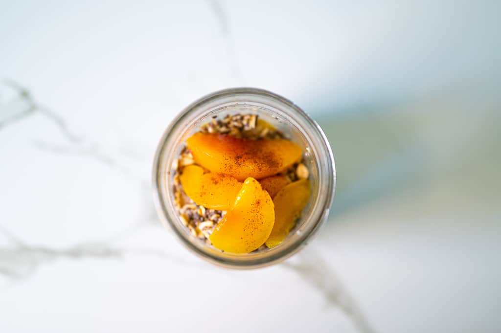 oats and peaches combined together for overnight oats