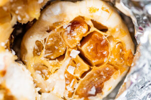 close up photo of roasted garlic with salt