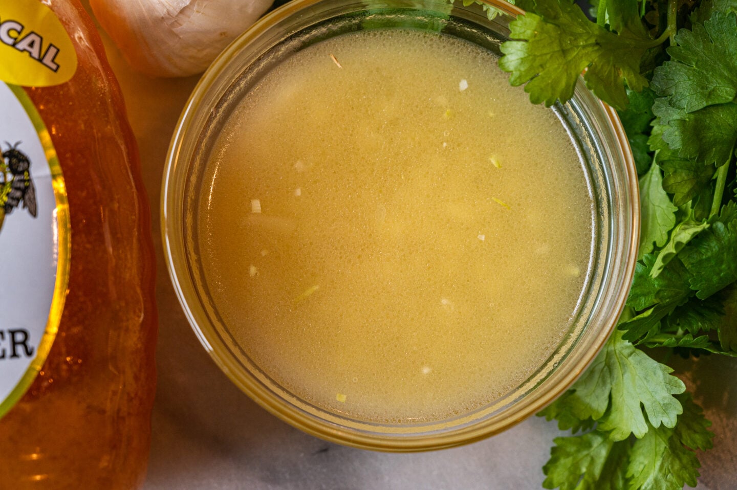 apple cider vinaigrette with cilantro leaves and honey