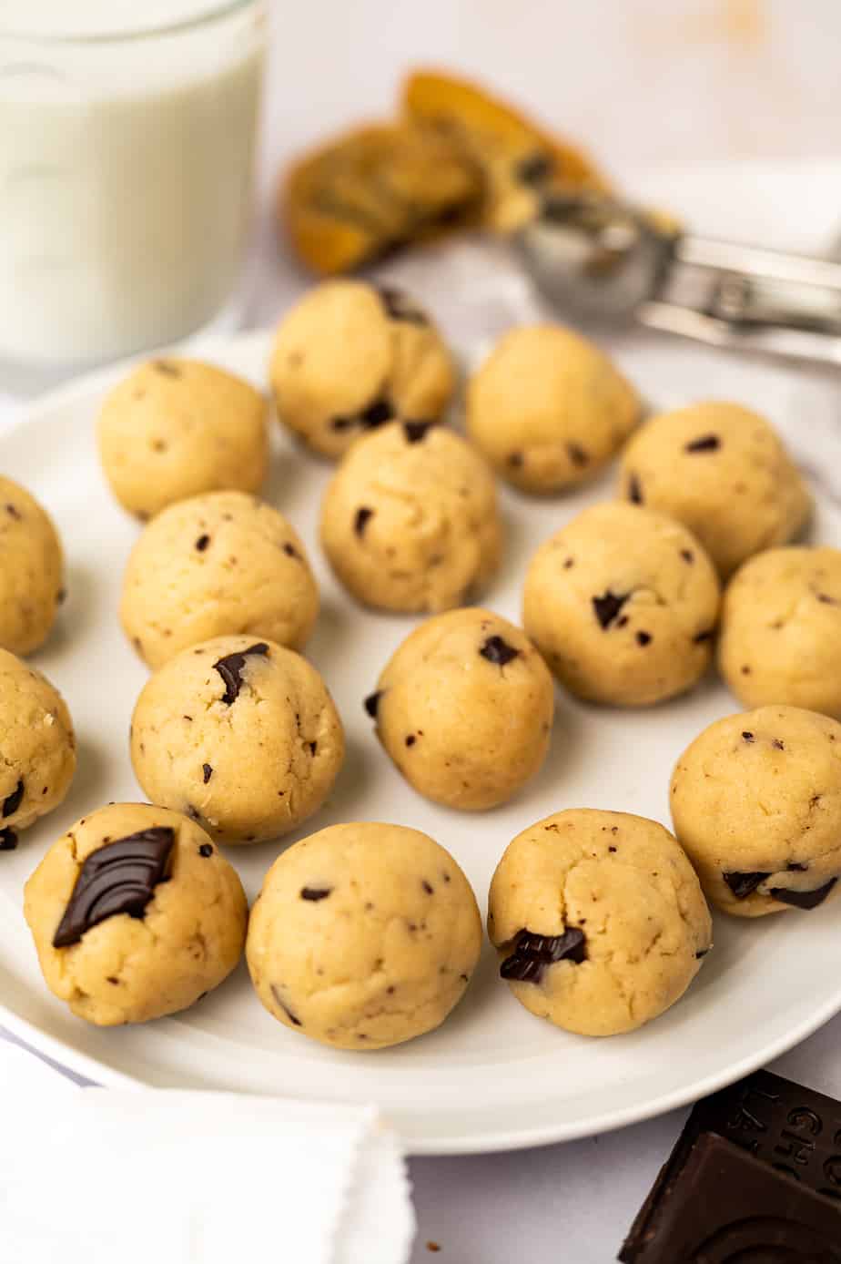 edible chocolate chip cookie dough balls laid out on a plate
