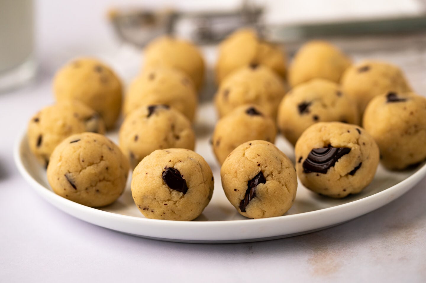forward photo of chocolate chip cookie dough balls with pieces