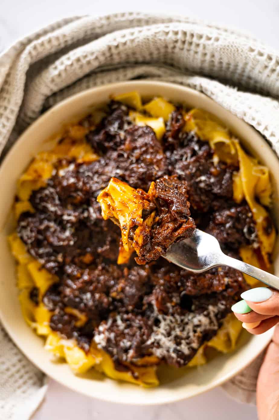 short rib ragu with pasta on a fork