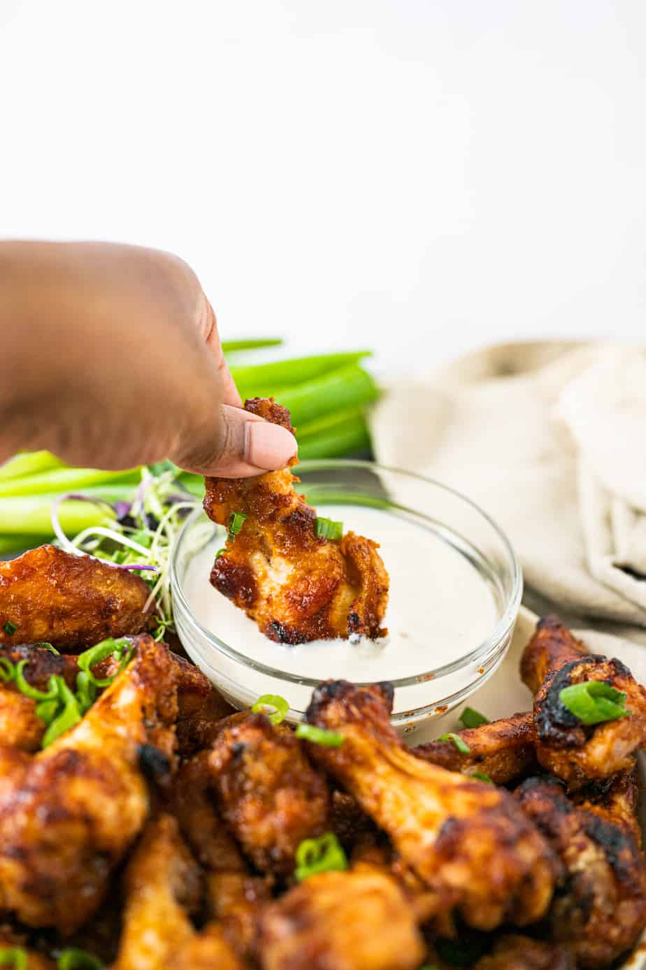 Miso wings dipped in ranch dressing