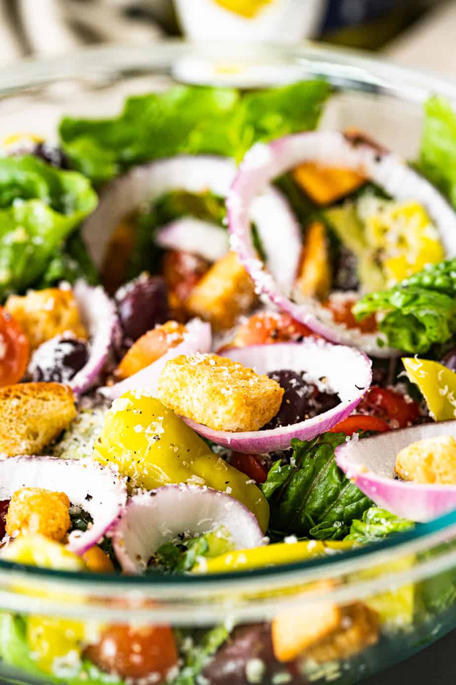 olive garden salad with lettuce, parmesiano reggiano, pepperoncini and red onion