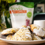 Lemon and lavender scones with a cup of tea and truvia sweet complete on a table.
