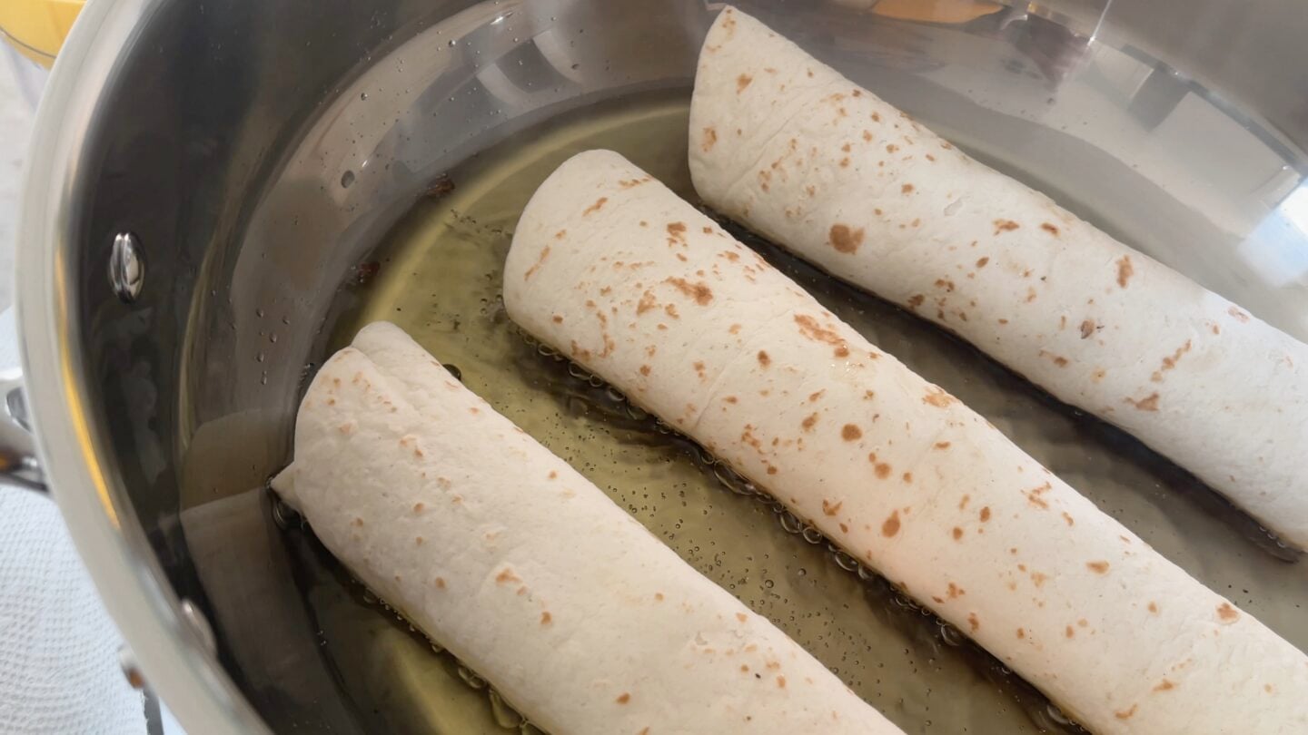 taquitos cooking in hot oil