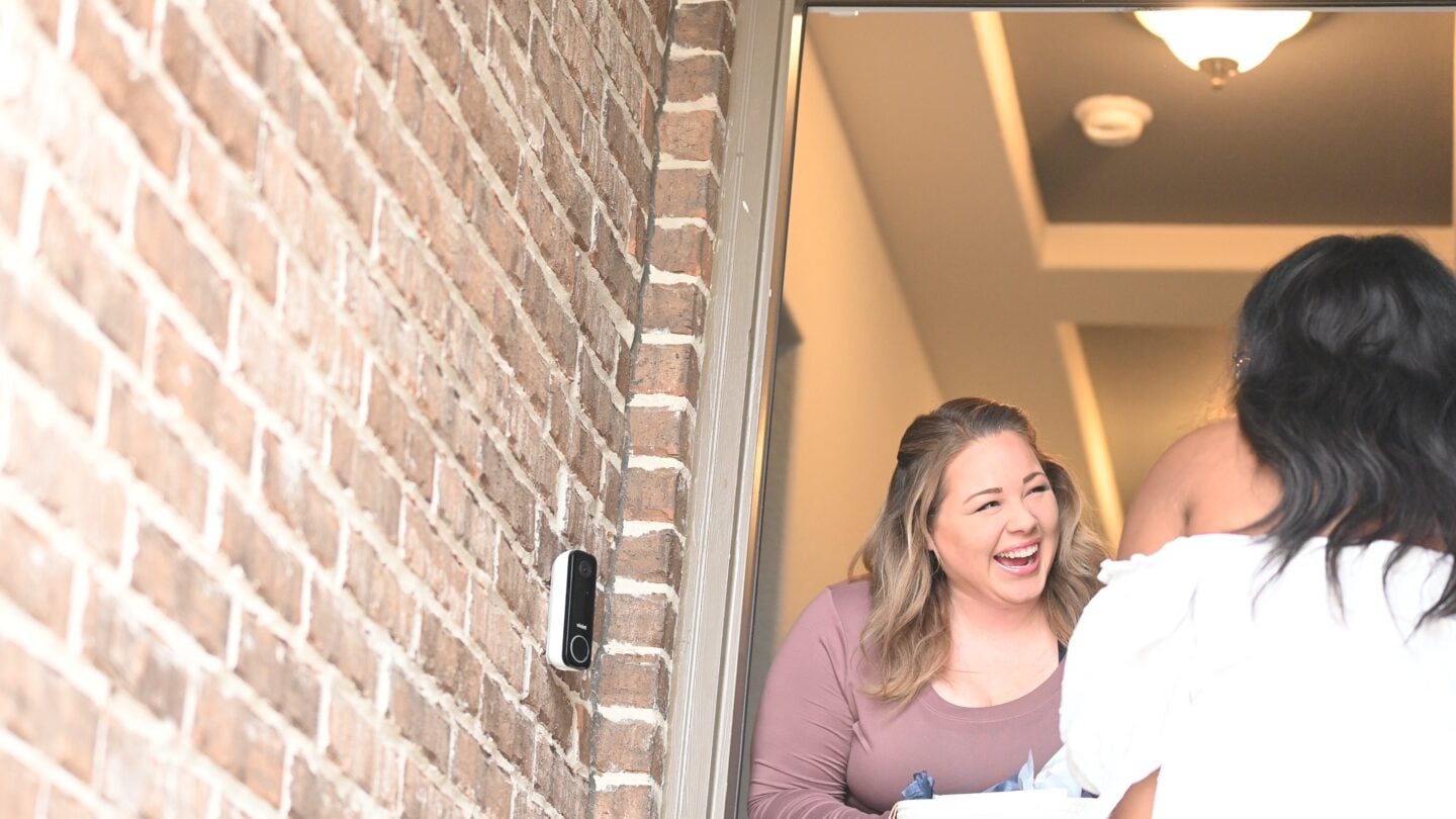 Katie smiling at door