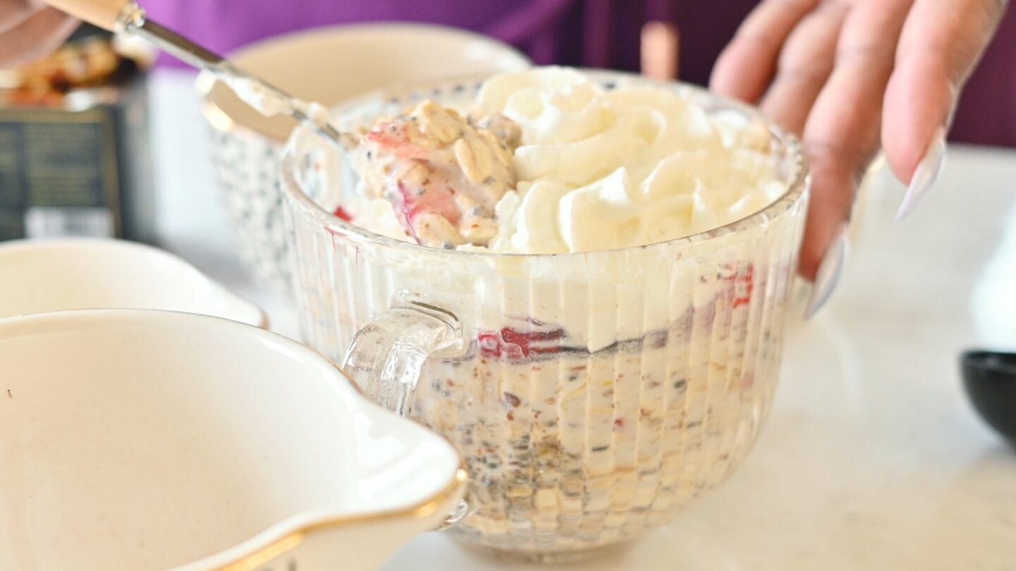 Overnight oats being scooped out of the bowl
