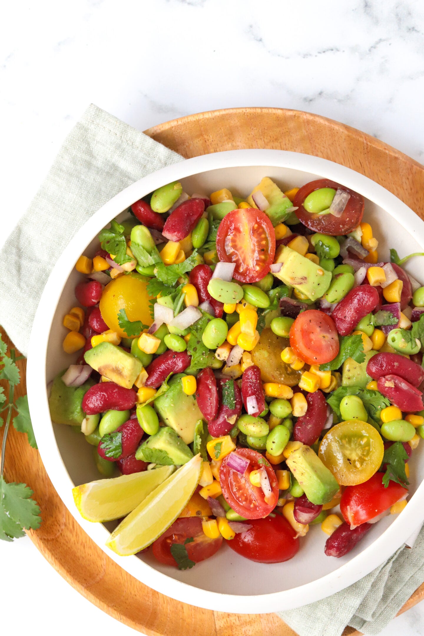 Tomato and Edamame Salad in a bowl pictured from above.