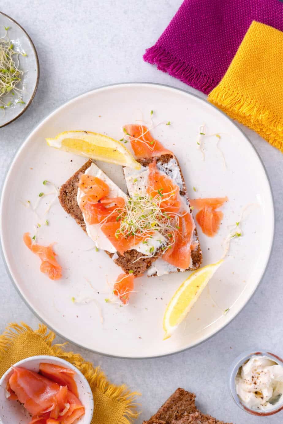 flat lay of a smoked salmon toast on rye bread.